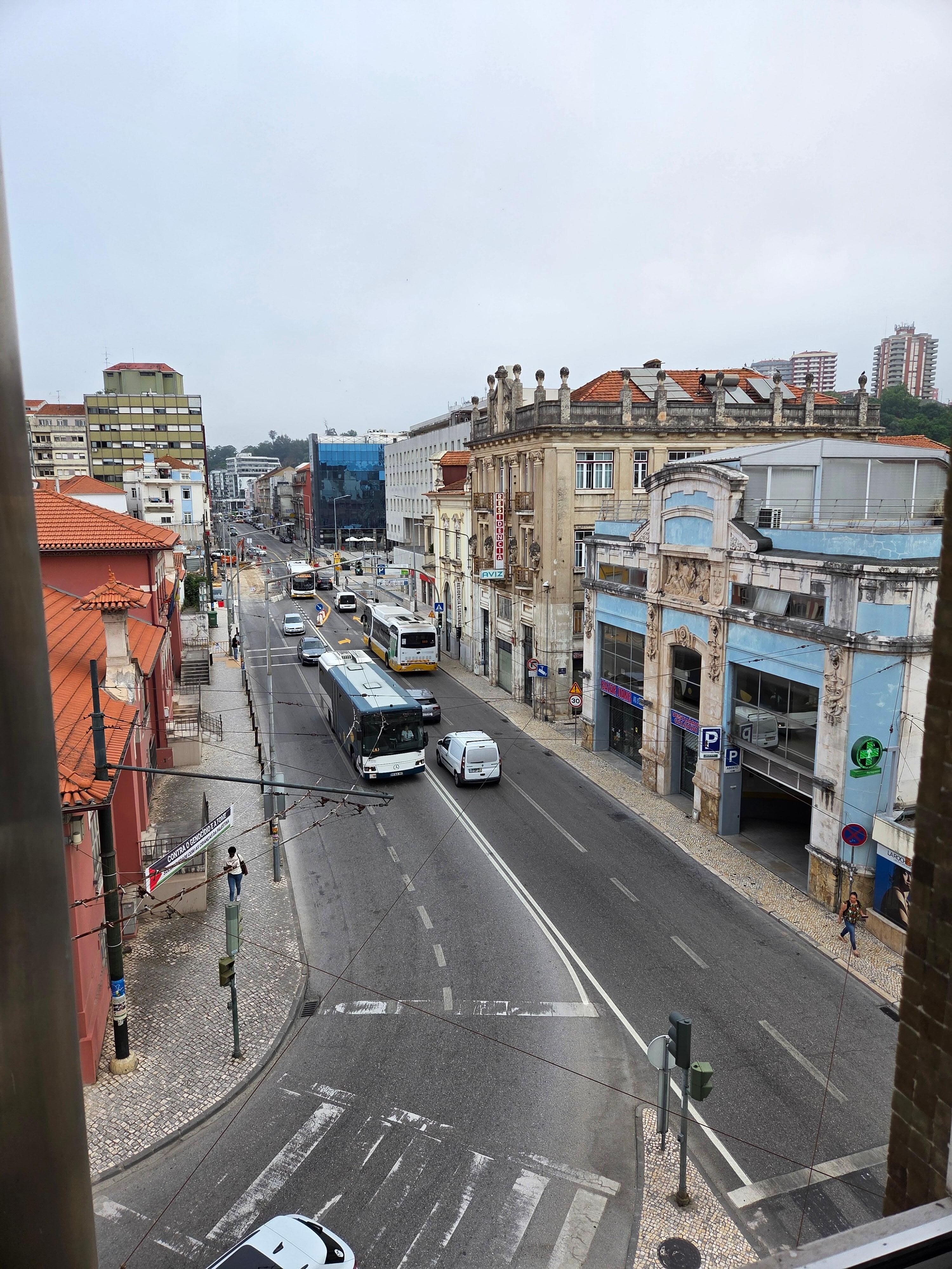 view from our room to front of hotel, parking across the street in the blue building.