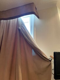 Curtain just being held with a hanger leaves a big hole for light