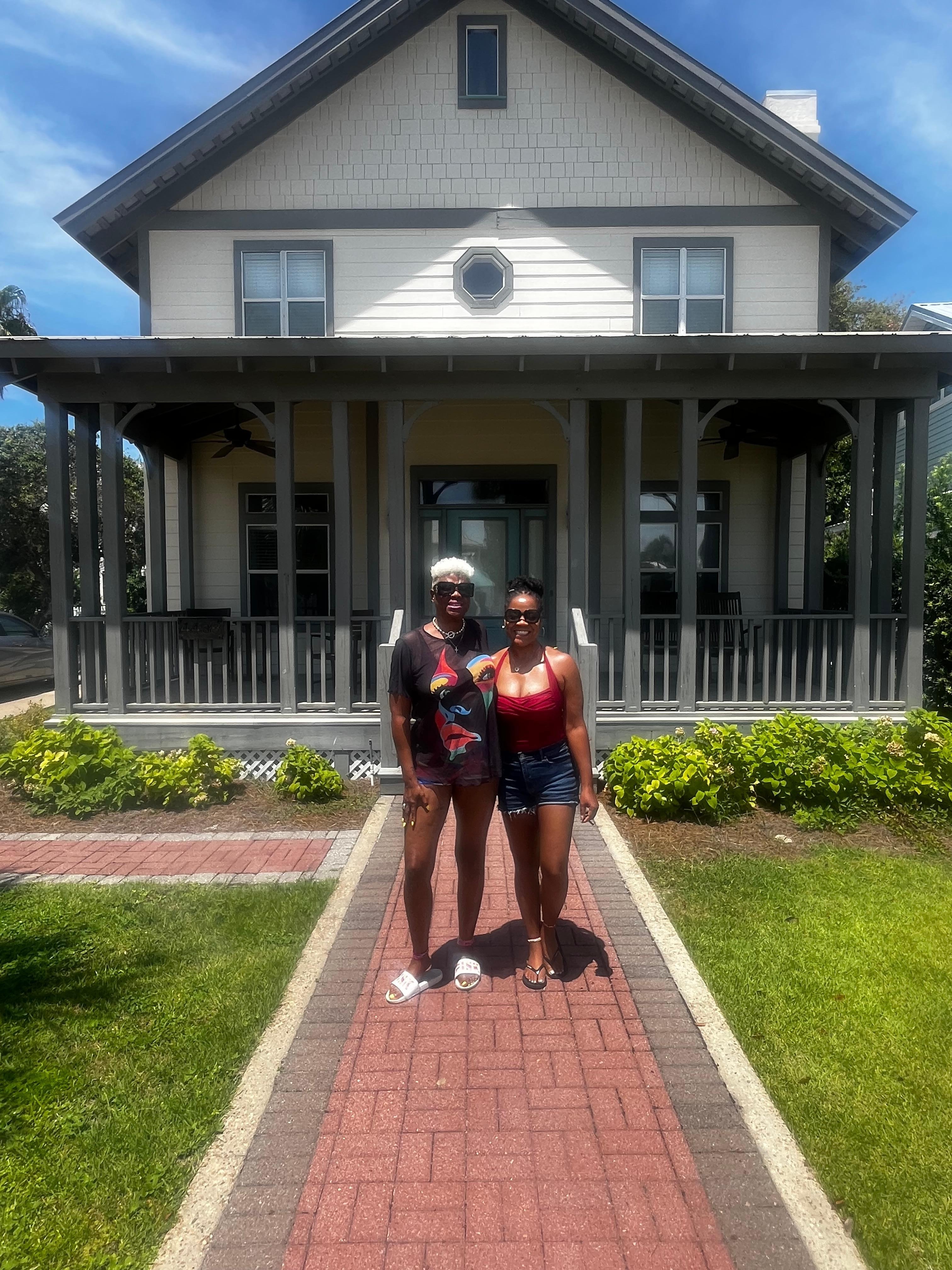 CEZ and Kim (Sisters) in front of the house.