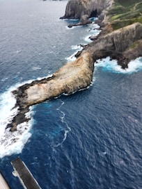 Helicopter ride with doors off seeing maui.