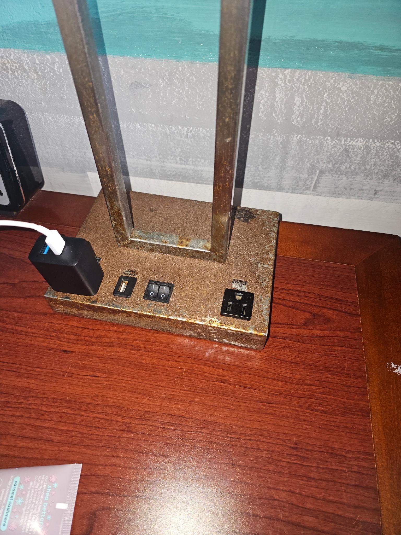 Rusted nightstand lamp.