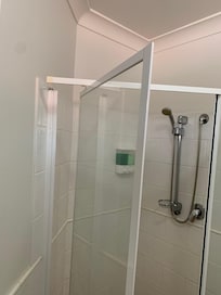 Shower door hanging off frame