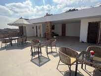 Hot rooftop for breakfast. Only one umbrella. Yes great view of pyramids but really no restaurant there yet