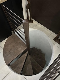 Spiral staircase to bedroom / bathroom area