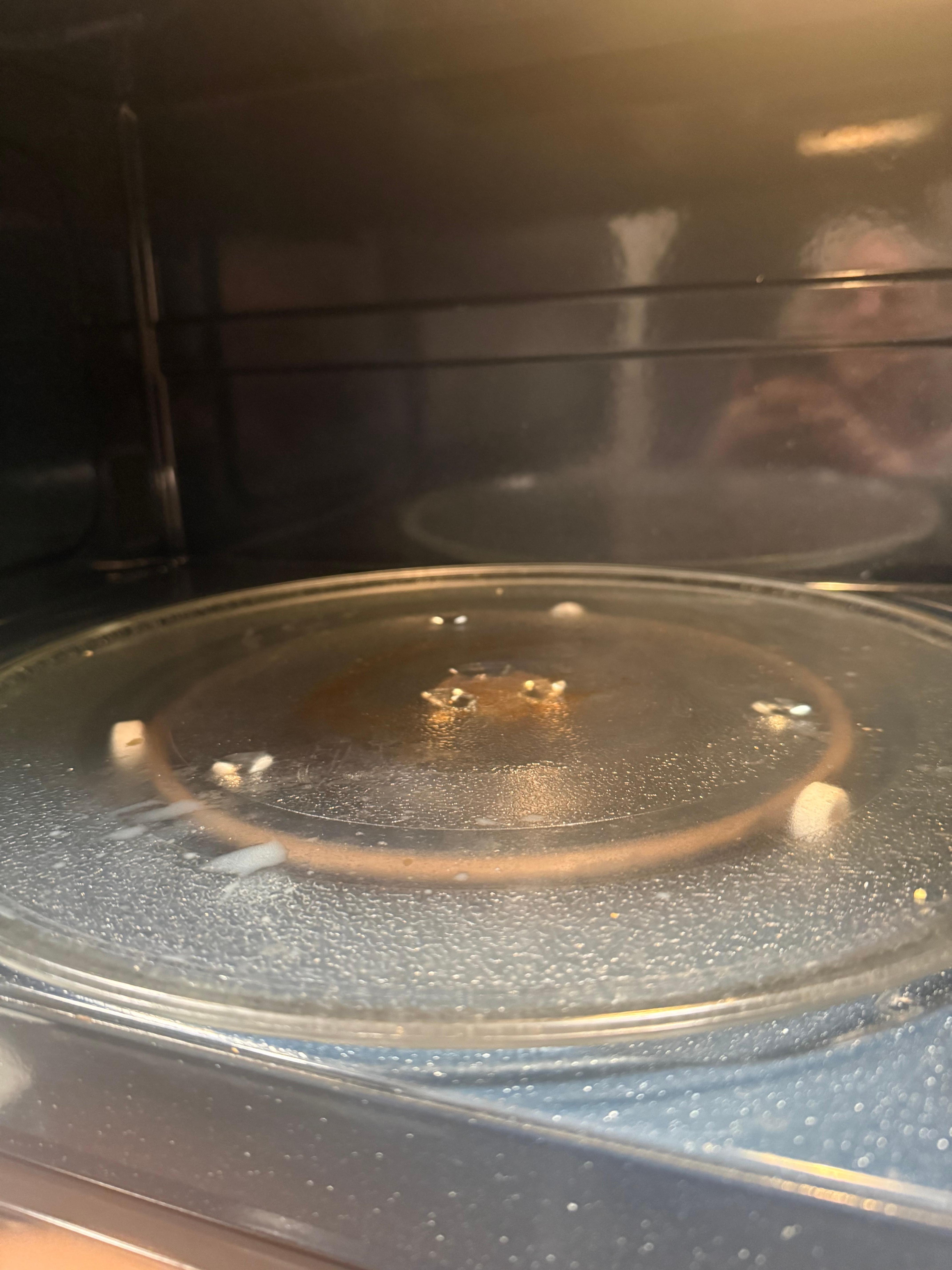White globs of bacon grease in microwave 