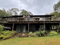 Waving from the deck that wraps around most of the house