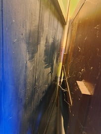 Cobwebs behind headboard