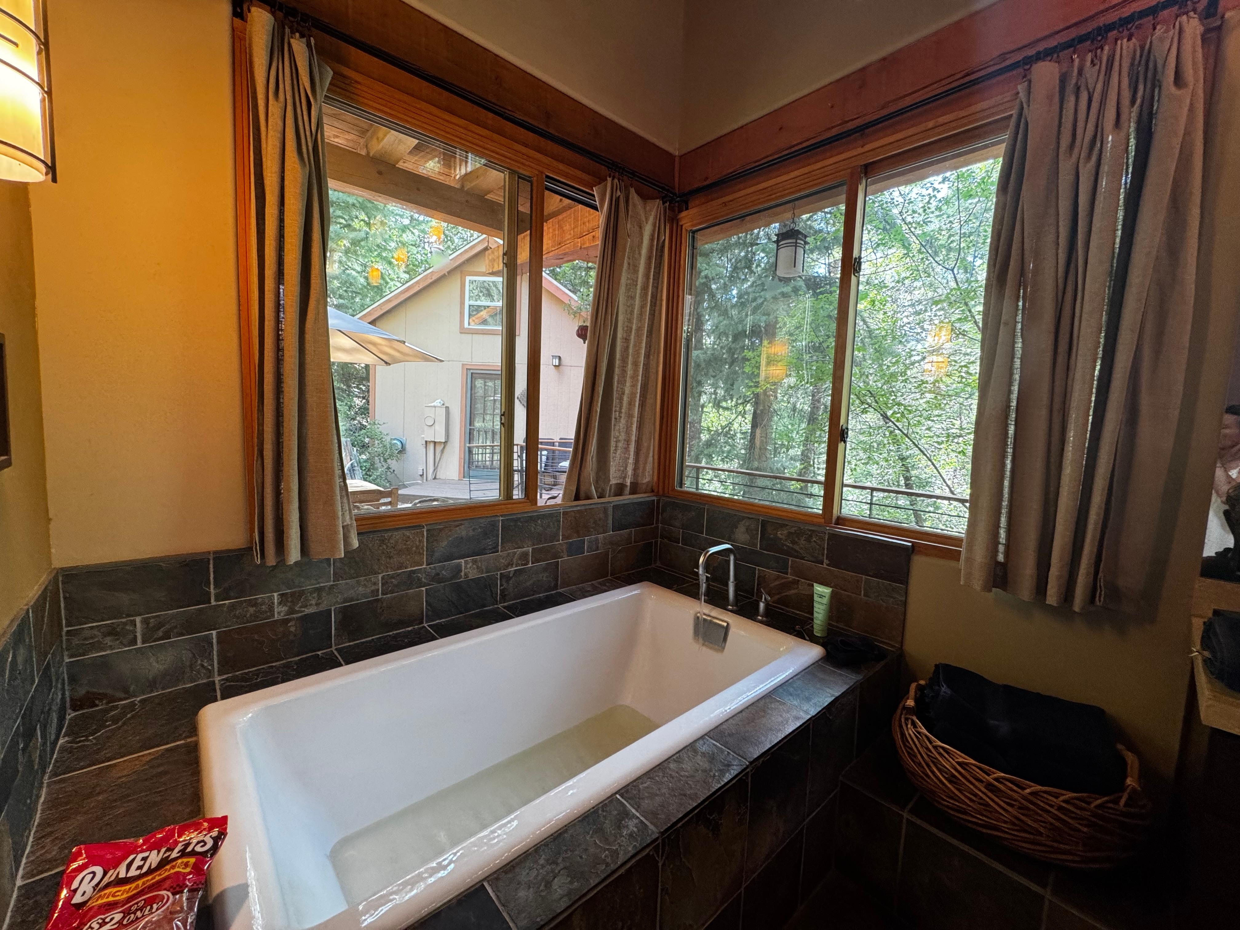 Massive tub surrounded by windows 