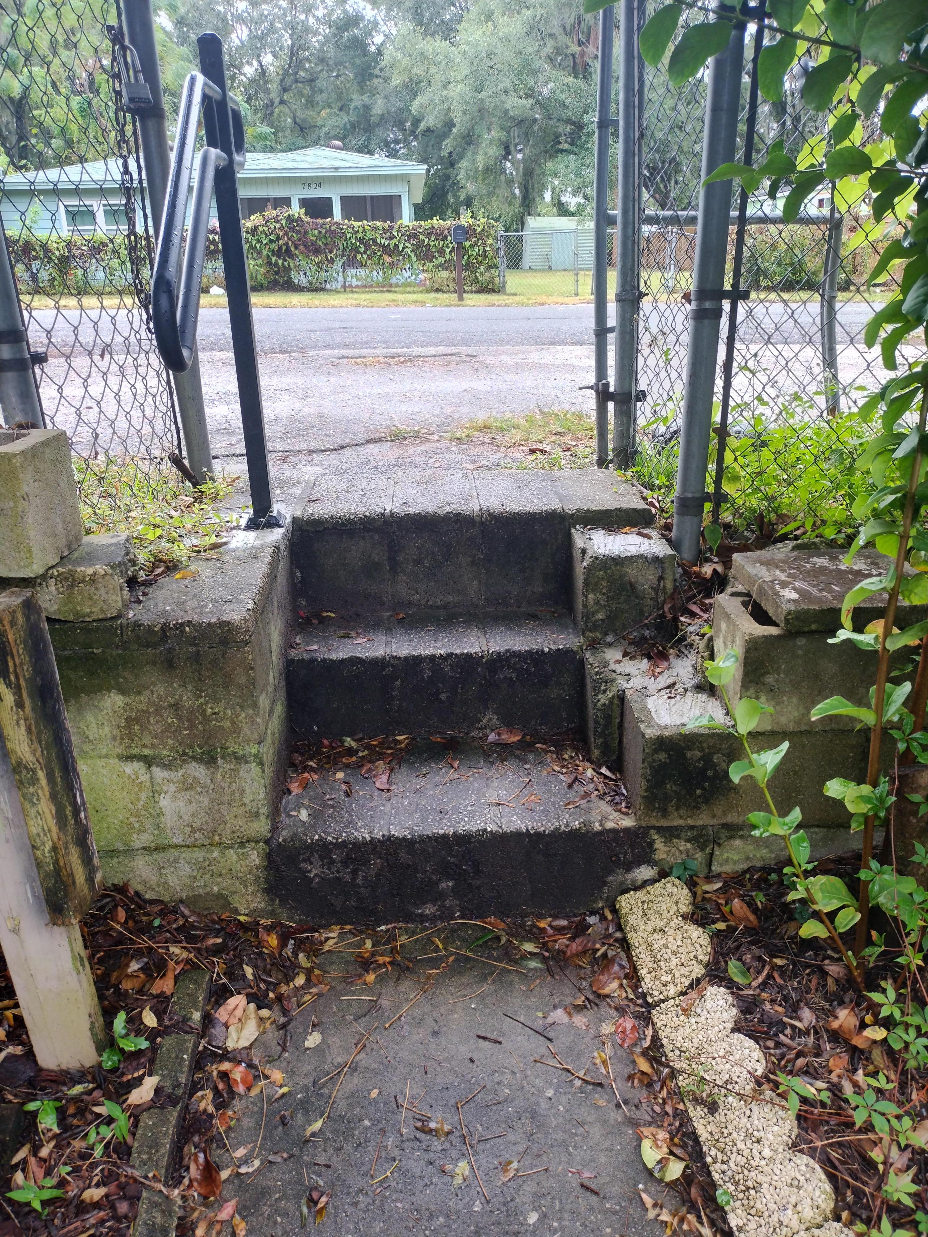 Stairs to access the yard and front door