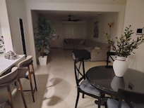 Comfortable living room with big screen TV and long sectional couch to relax