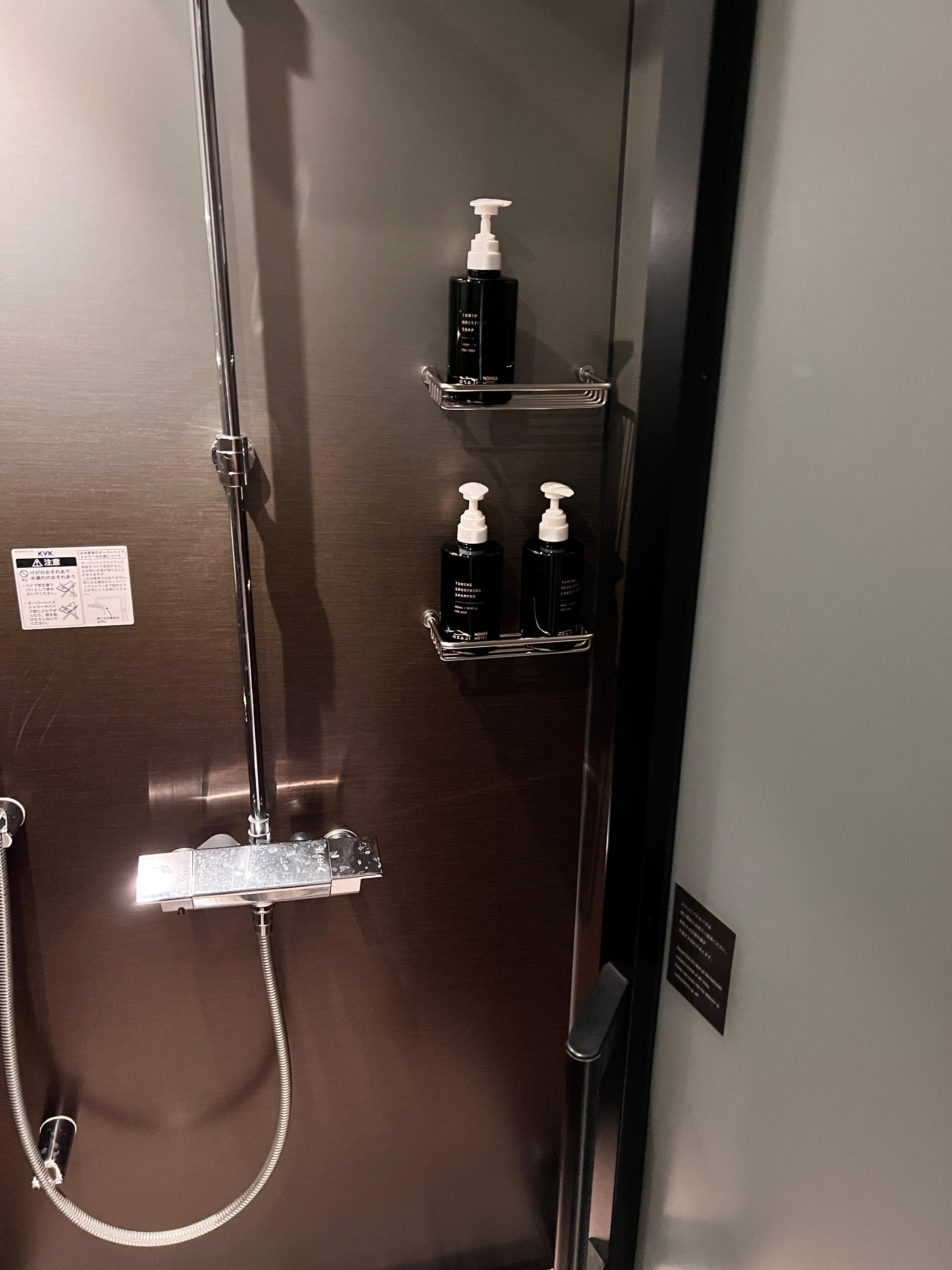 Nice shower area. Comes with shampoo, conditioner, and body wash. The shower is overhead and quite nice!