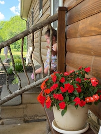 My grand daughter on the front porch