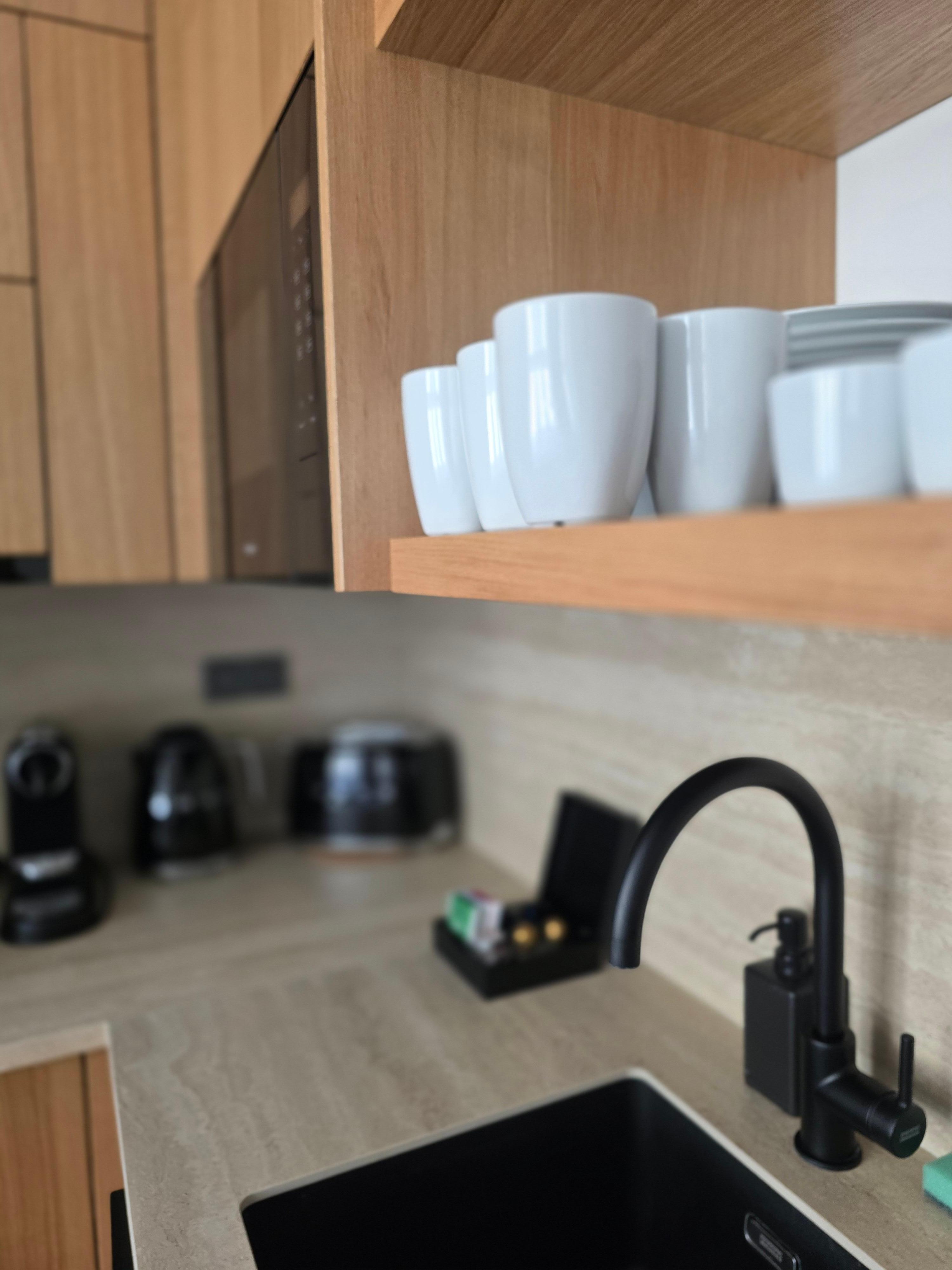 Kitchen with Miele appliances and other small appliances like the toaster, espresso and kettle