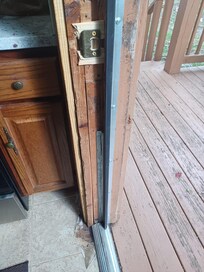 Entrance door looks as if broken into at some time