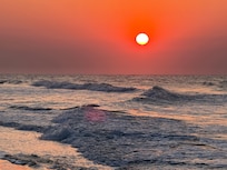Hello sun. Beautiful sunrise on the beach