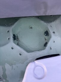 Light green water and lots of dirt in hot tub