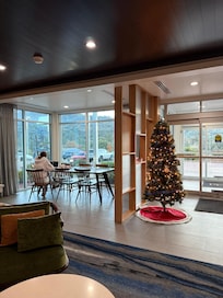 Festive Christmas tree greeting us by the door.