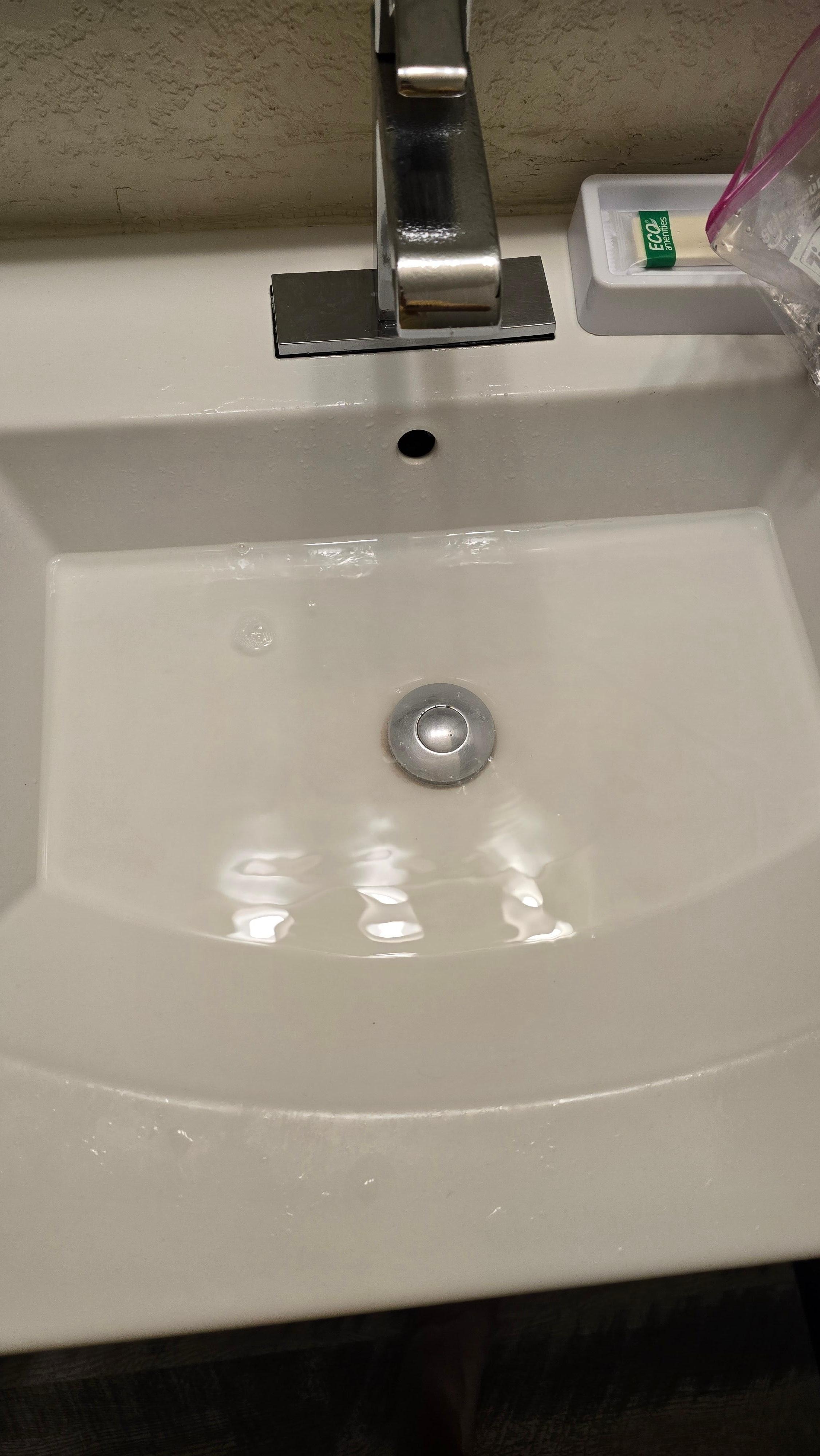 Sink was clogged, barely draining. Gross.