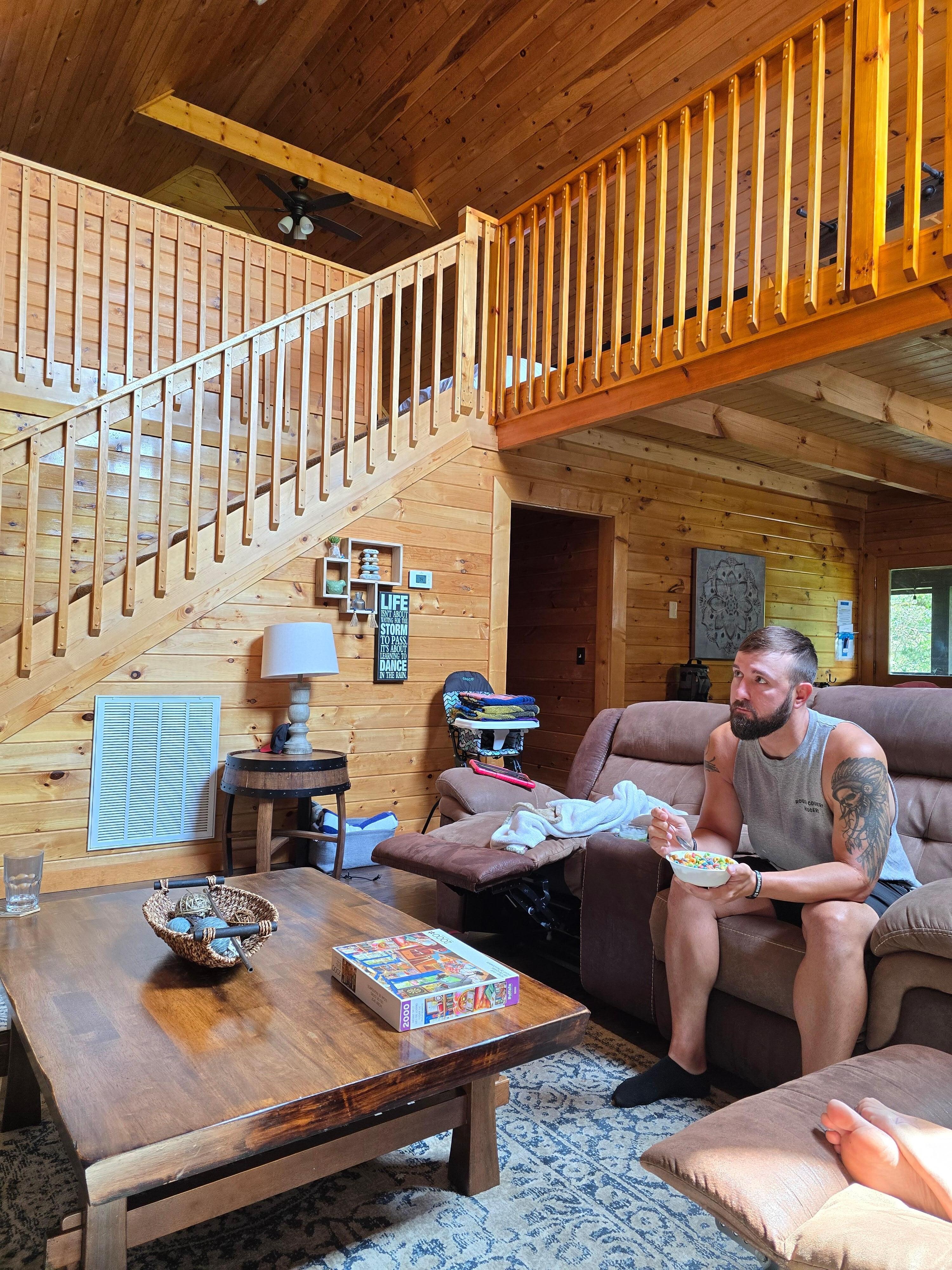 Family time against beautiful stairway to onus bedroom and arcade. 