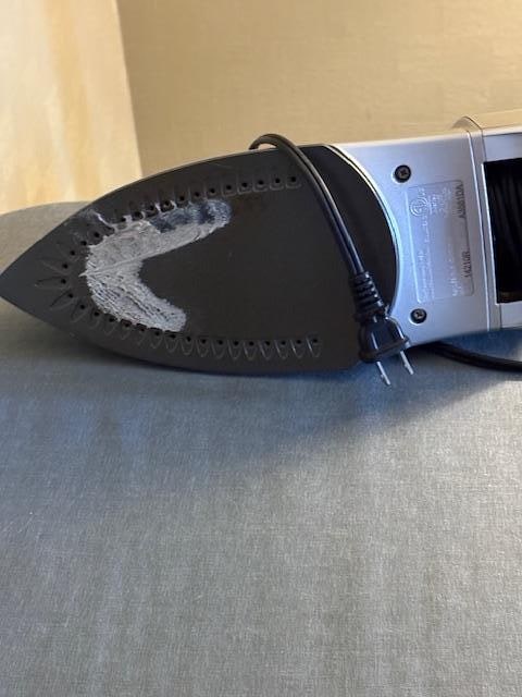 Get the stuff off the bottom of the iron!