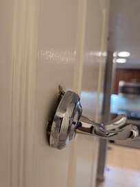 The cloth holder on back of door will not hold on door