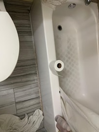 Bottom of the tub was dark and rust around the edge of the outside of the shower