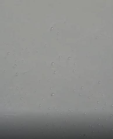 Water droplets over bed.