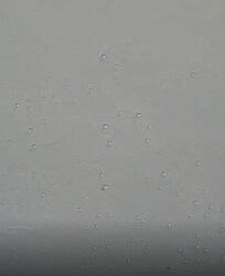 Water droplets over bed.