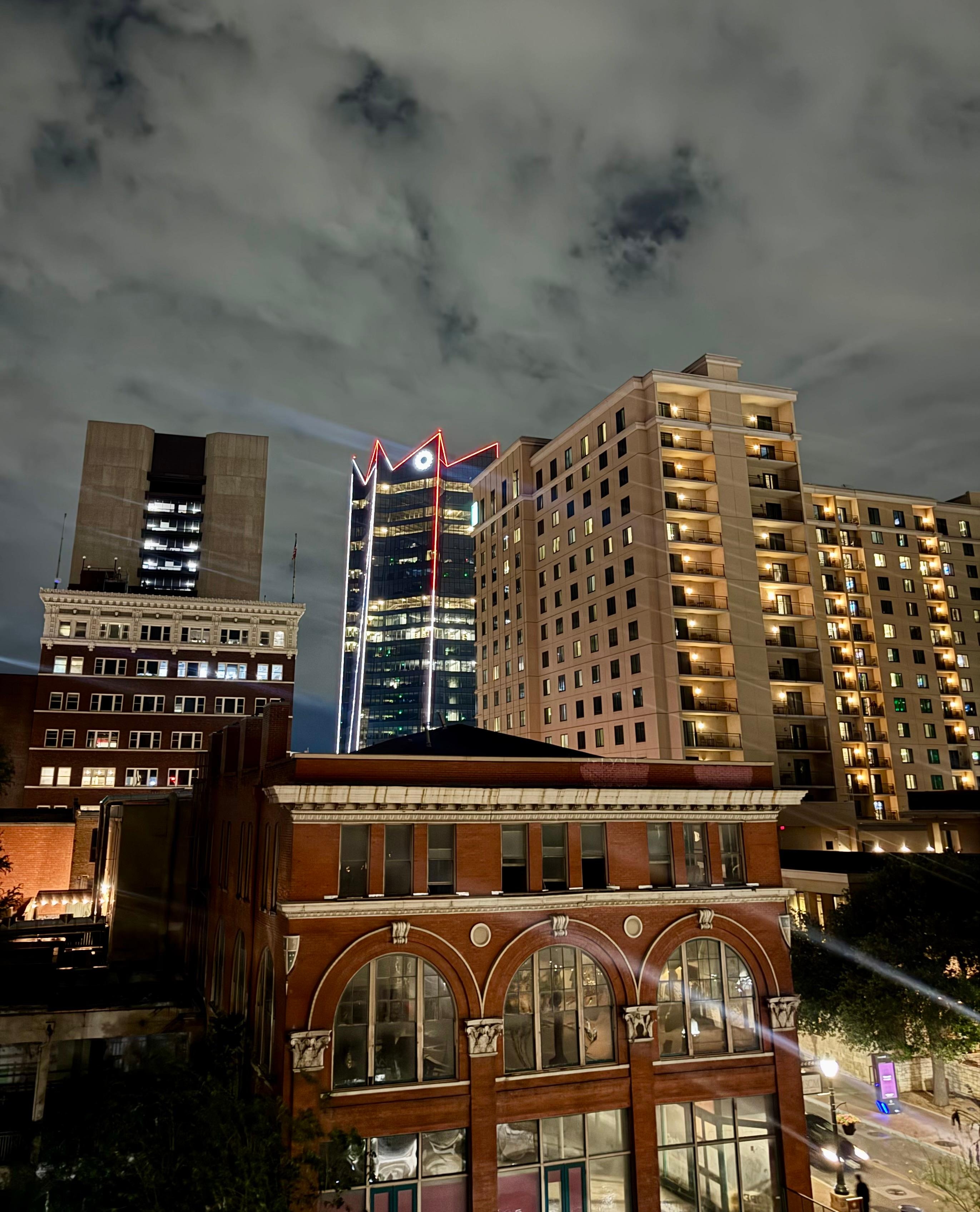 View from room at night… abandoned buildings below.. saw homeless around and in side building 