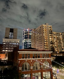 View from room at night… abandoned buildings below.. saw homeless around and in side building