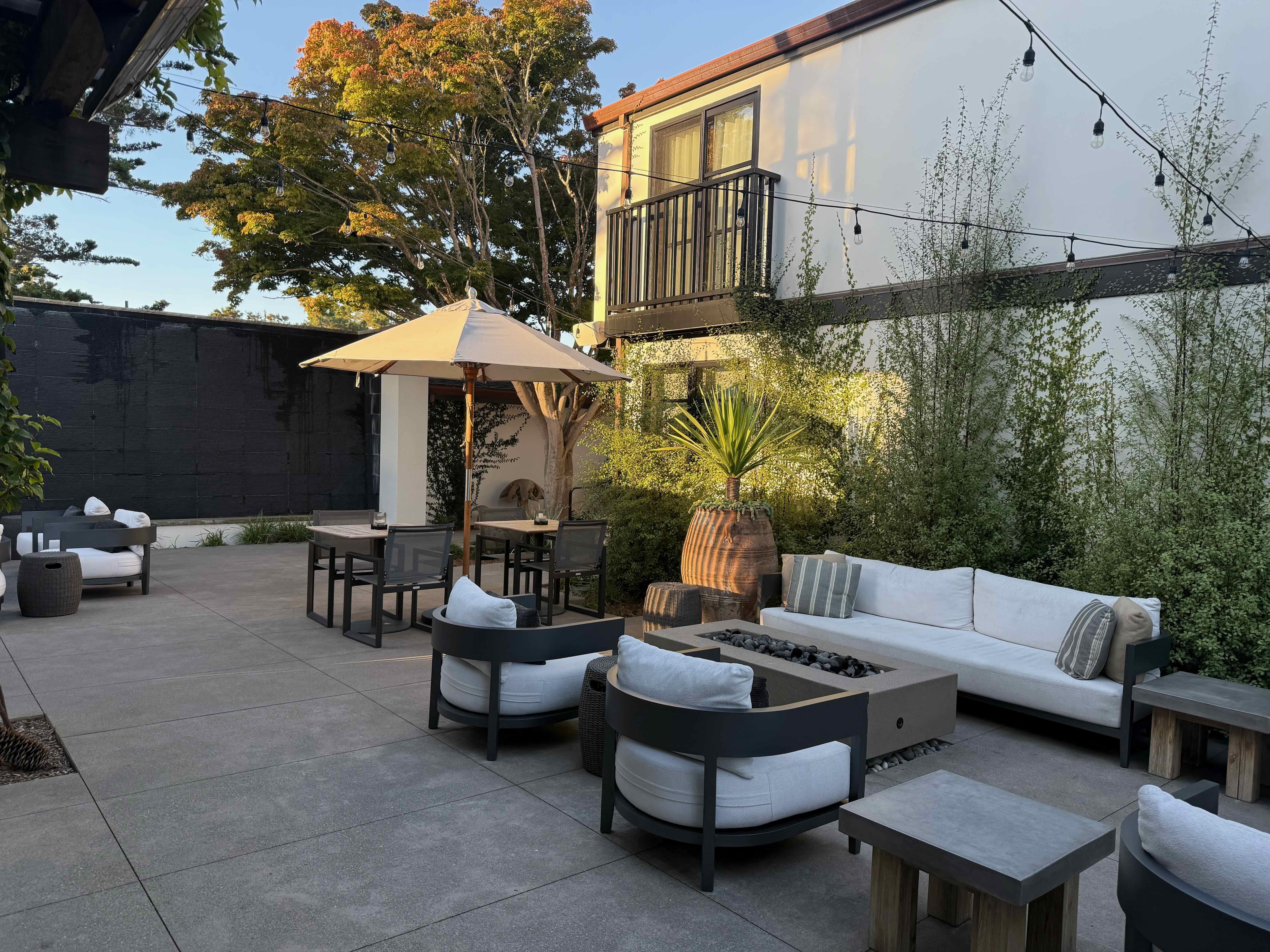 Small but charming outdoor seating with heat lamps at night