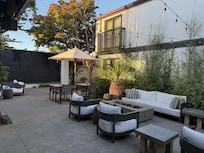 Small but charming outdoor seating with heat lamps at night