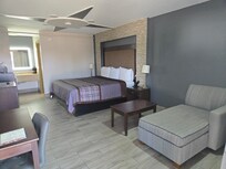 Room is spacious, nice first impression. But bed area dark - no overhead lights and nonworking lamps.