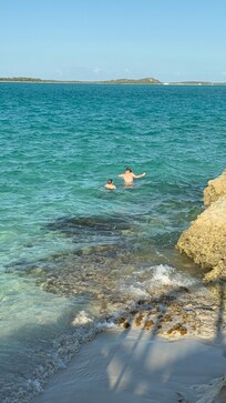 The boys snorkeling right out back! Easy and safe access into the water!