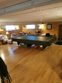 Common area with a large pool table.