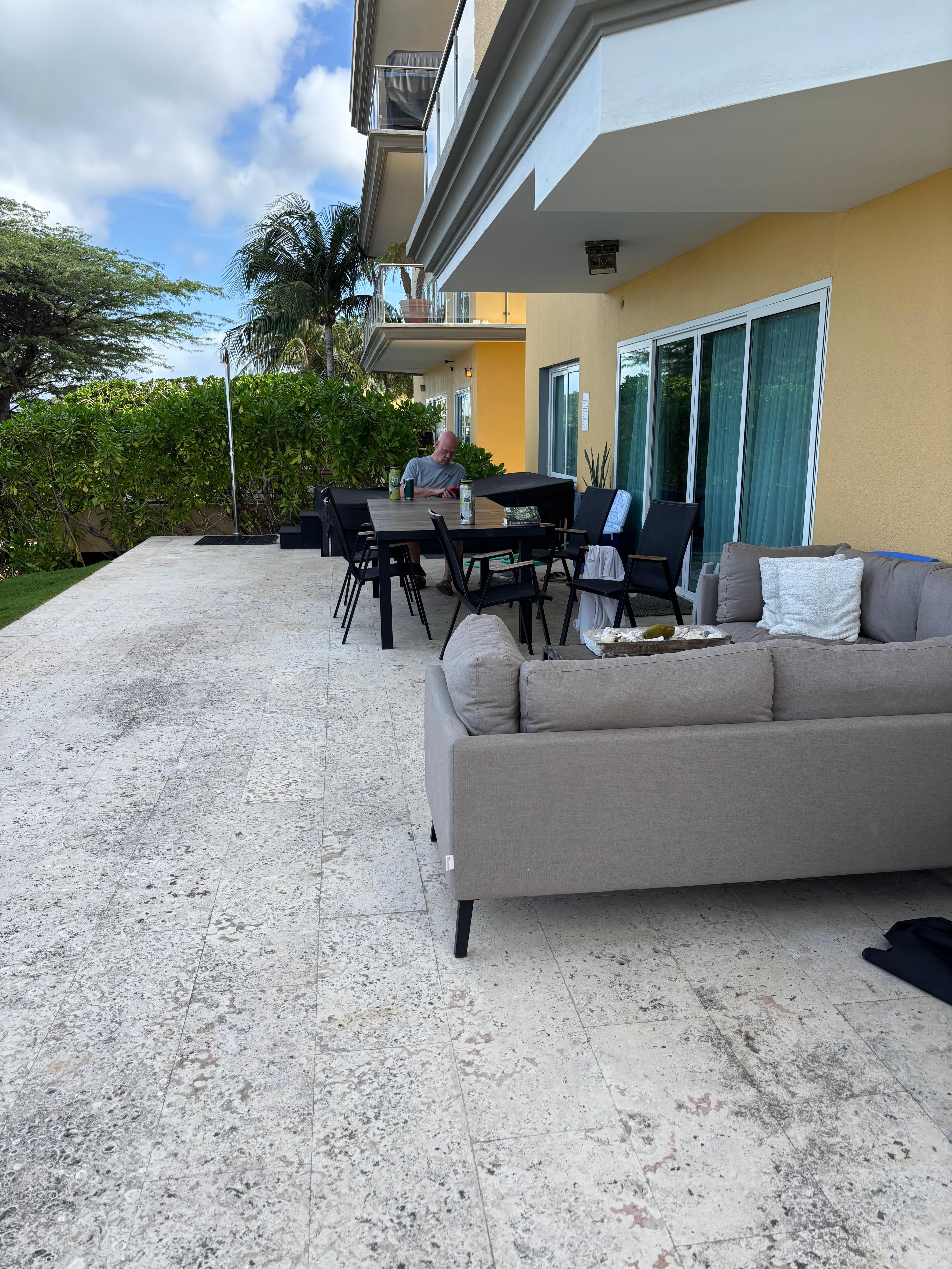 Shaded and welcoming lanai... steps to the beach. 