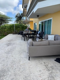 Shaded and welcoming lanai... steps to the beach.