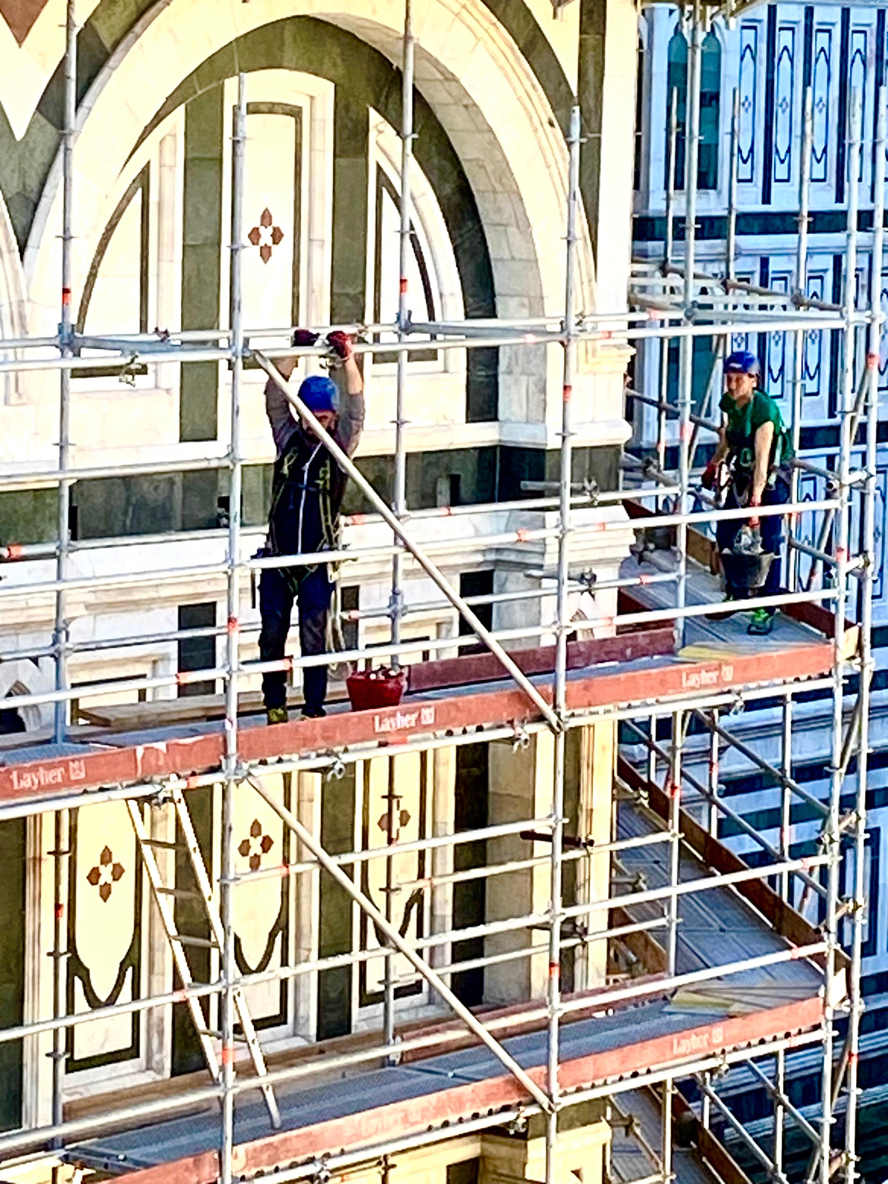 The scaffolding coming down after a long cleaning.