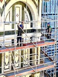 The scaffolding coming down after a long cleaning.