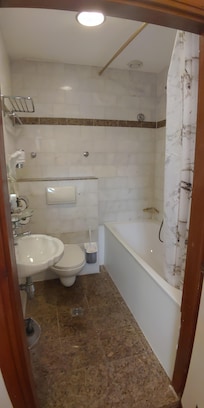 Bathroom with bathtub.