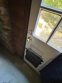 Hole in door secured by duct tape