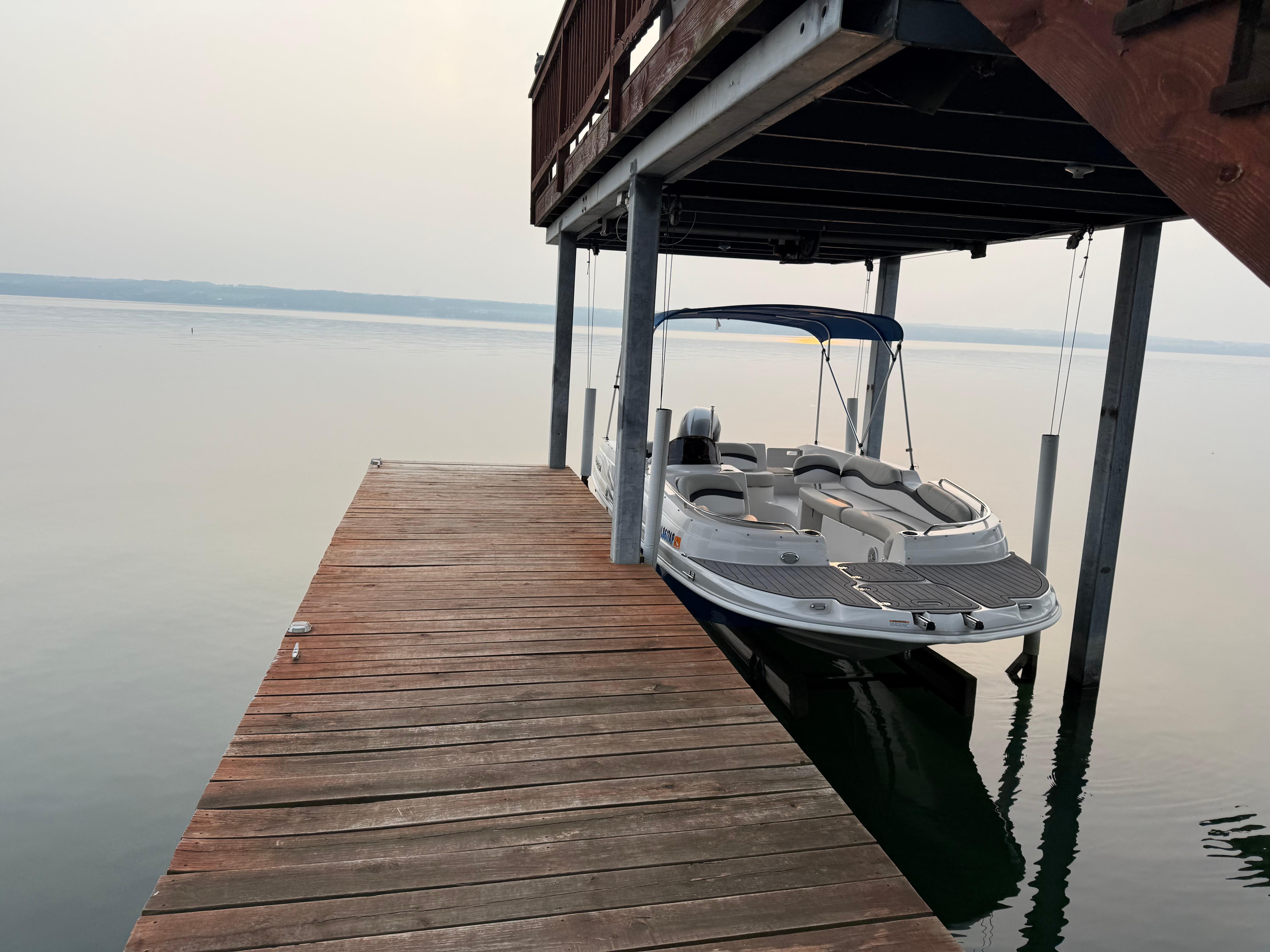 Private deck with boat lift.
