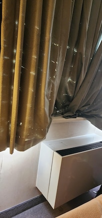 The curtains were shredded and tattered. It was terrible.