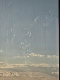 Hand prints on the window of the suite