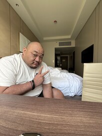 View of the inside of a double twin room. No closet. Just an open armoire/shelf