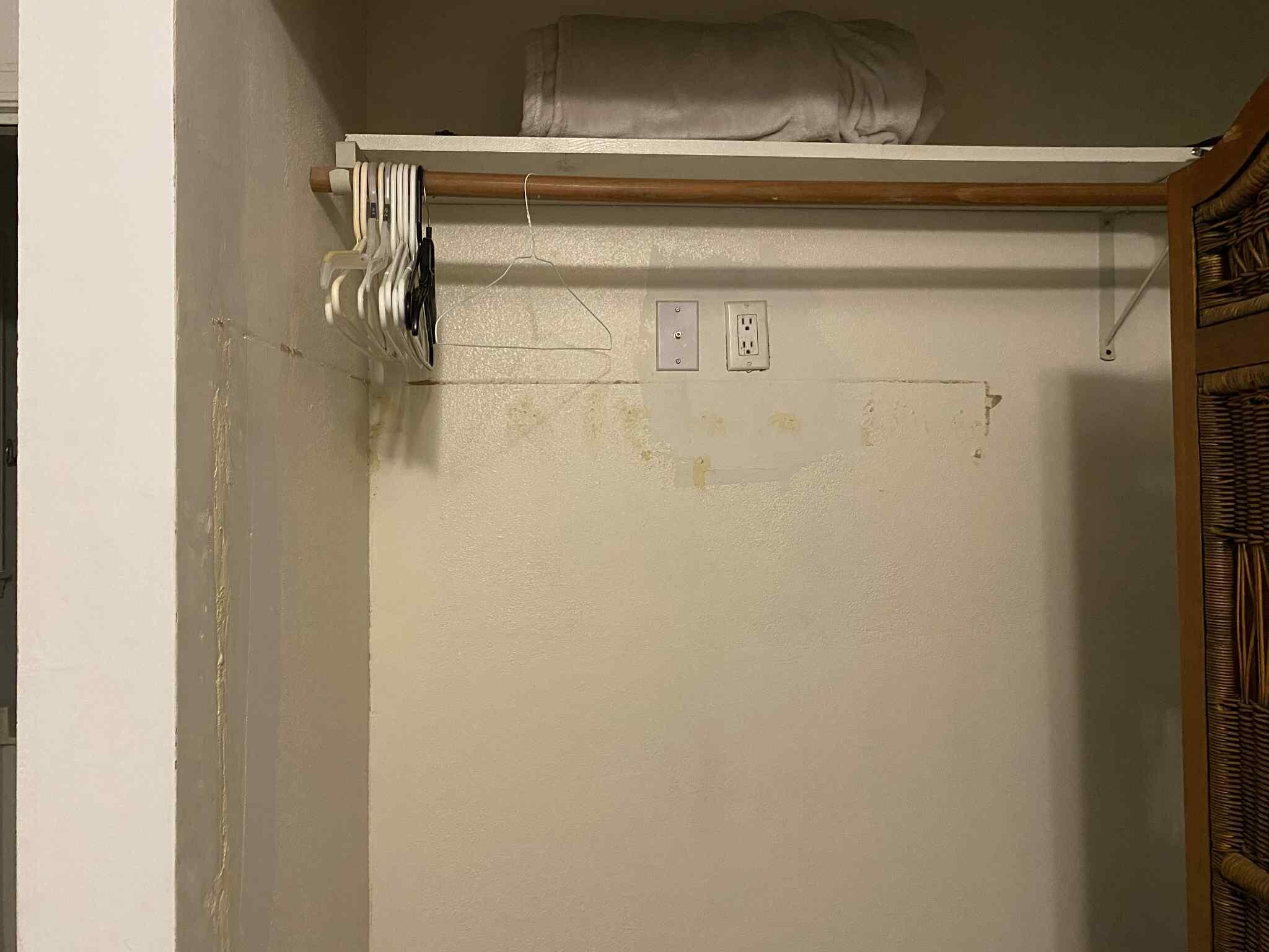 Master bedroom closet had partial bi-fold cover, but still exposed the shelf and the well placed hole.