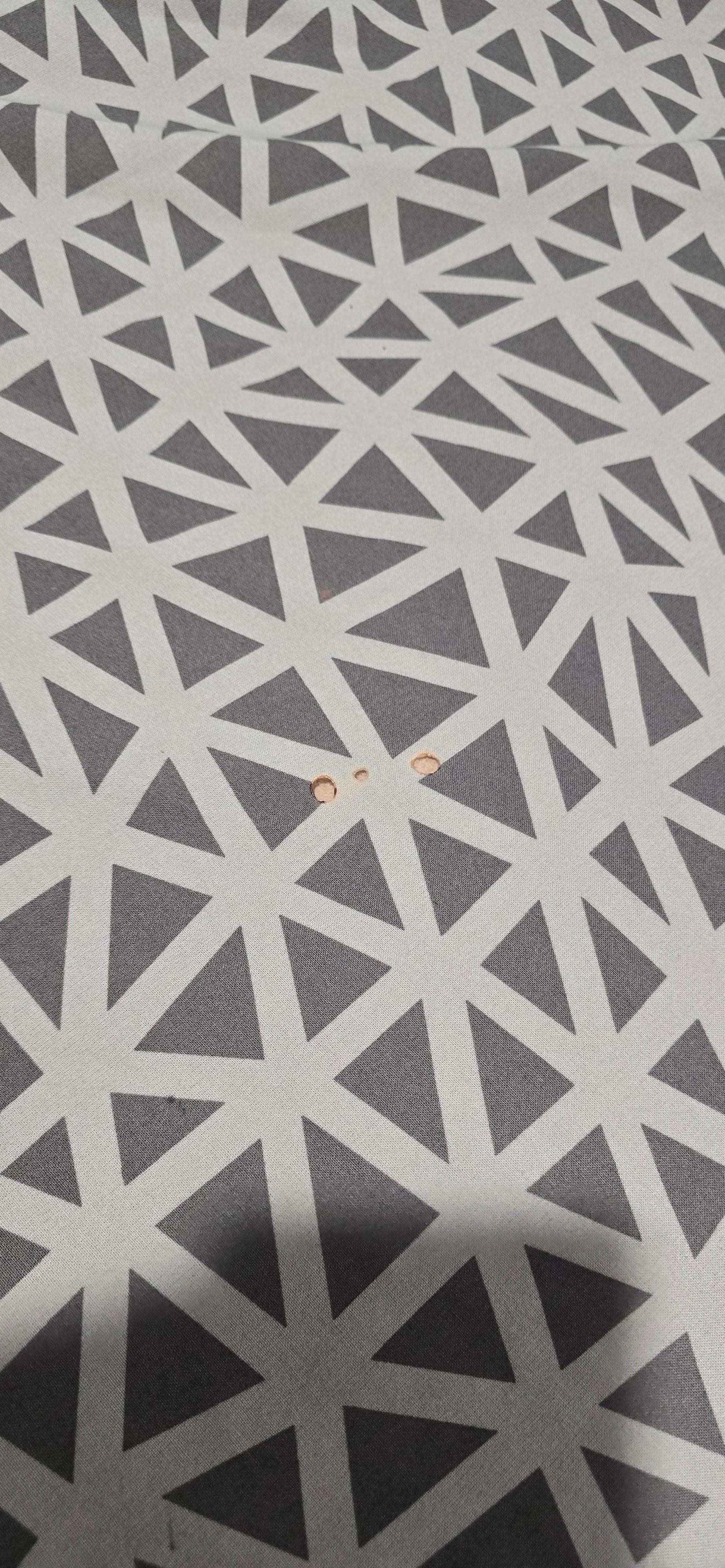 Cigarette burns on bedding.