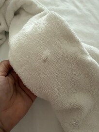 Worn towel with hole