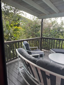 The main deck where you feel tucked into the trees