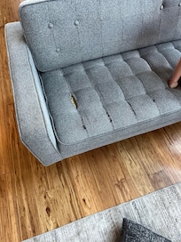 Couch in the upstairs game room..